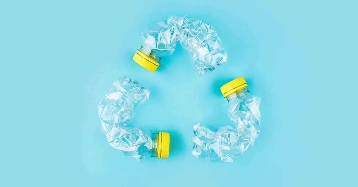 The recycling symbol composed of three plastic bottles
